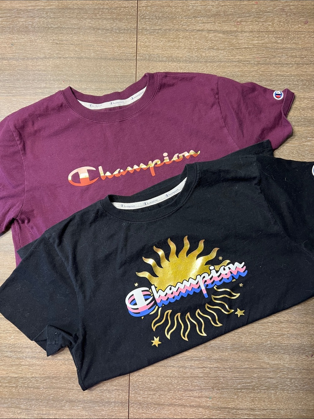 Champion women’s Short Sleeve Tees in Black & Maroon with Gold Sun Graphic